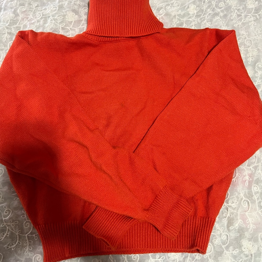 Zara cropped turtleneck sweater in the color orange and size medium.